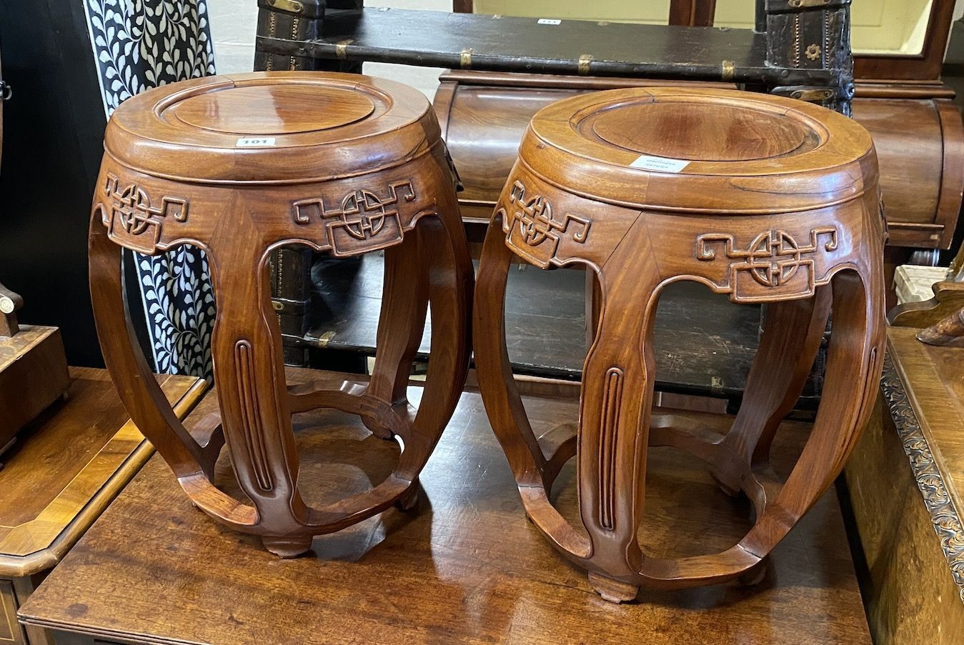 A pair of Chinese carved hardwood vase stands, diameter 36cm, height 47cm